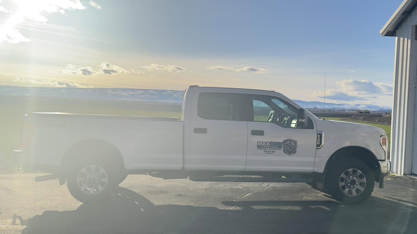 The RockBuilt work truck parked at sunrise before a job