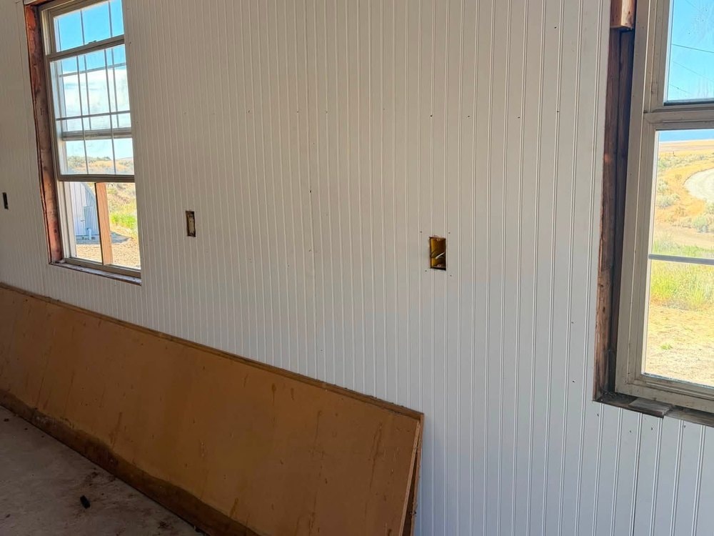 New white interior paneling between the two windows